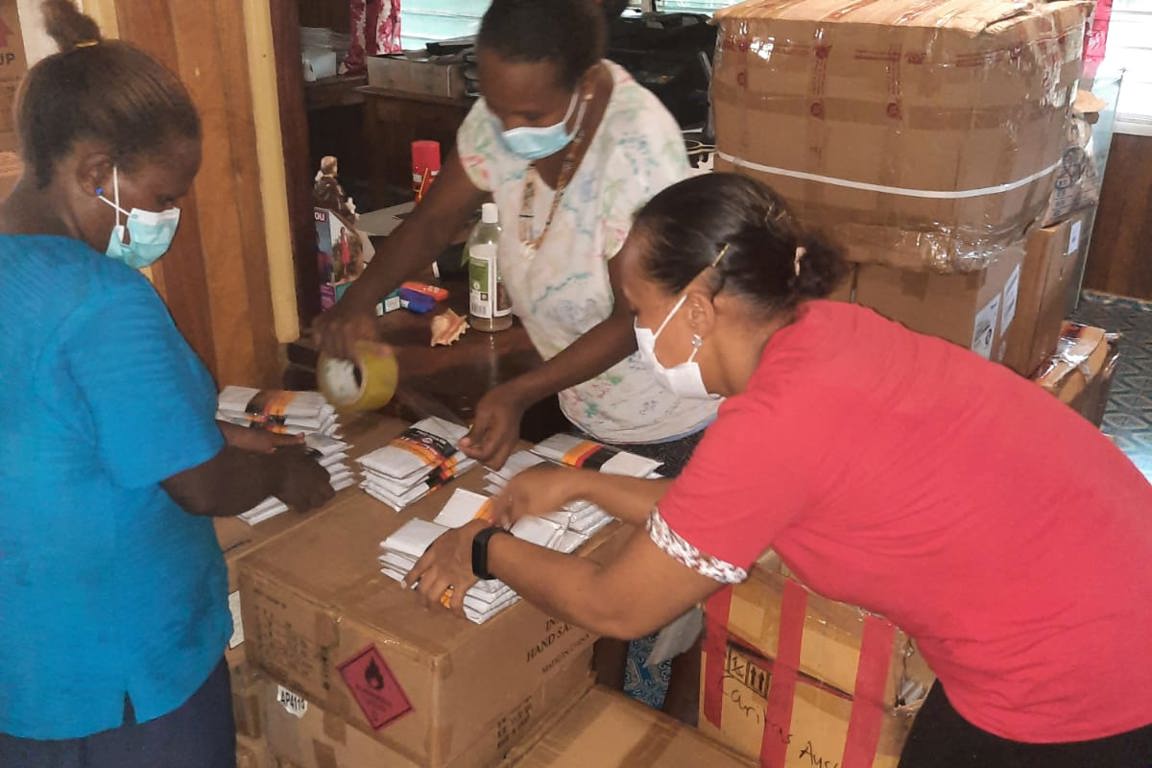 Staff preparing care kits in Solomon Islands