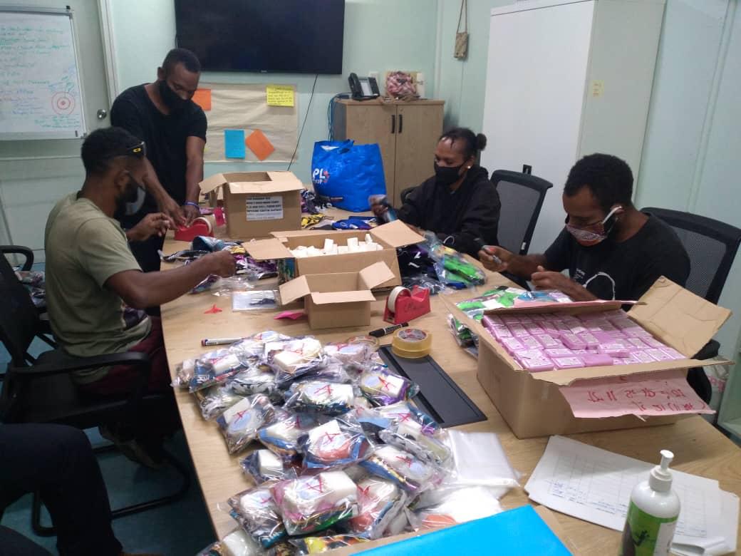 Group of people with hygiene kits in PNG