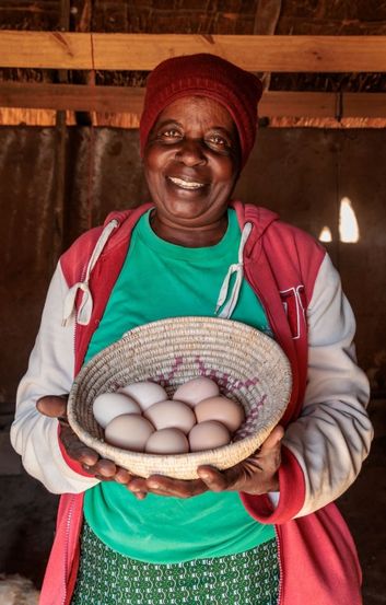 Priscilla Holding Basket Of Eggs