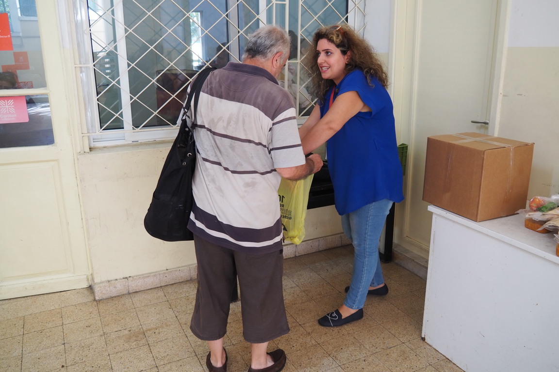 Christine Abboud Senior Social Worker At Caritas Lebanon Distributing Household Essentials Distribution In Beirut Photo Credit Caritas Australia