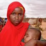 Marian and her eight-month-old daughter queuing at the Trócaire health outreach centre at an Internally Displaced Persons camp in Gedo district, southern Somalia.