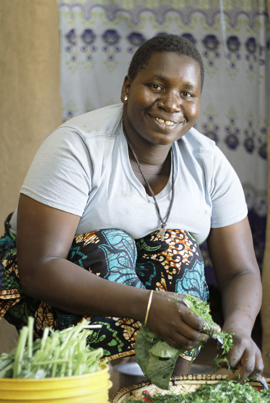 Maria preparing lunch in her home in Tanzania