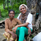 Martina outside her home talking with her councillor from a women's refuge in Timor-Leste