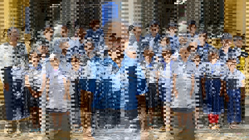 Salin In Front Of Her School