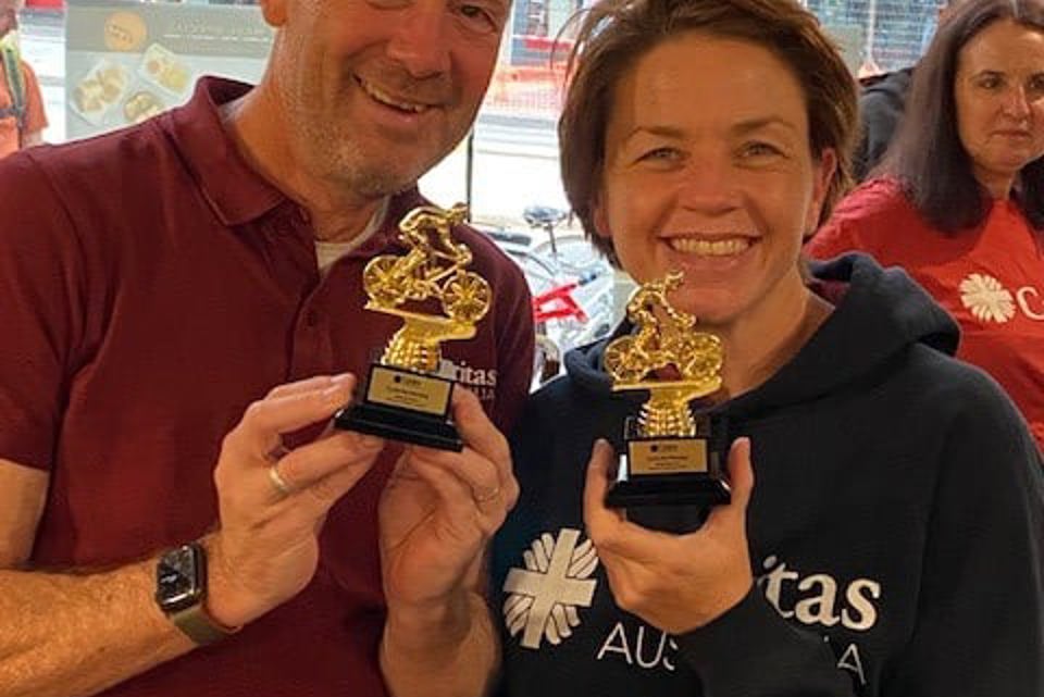 Kirsty And Richard With Trophies After They Completed Their Bike Ride From Sydney To Melbourne. Photo Caritas Australia