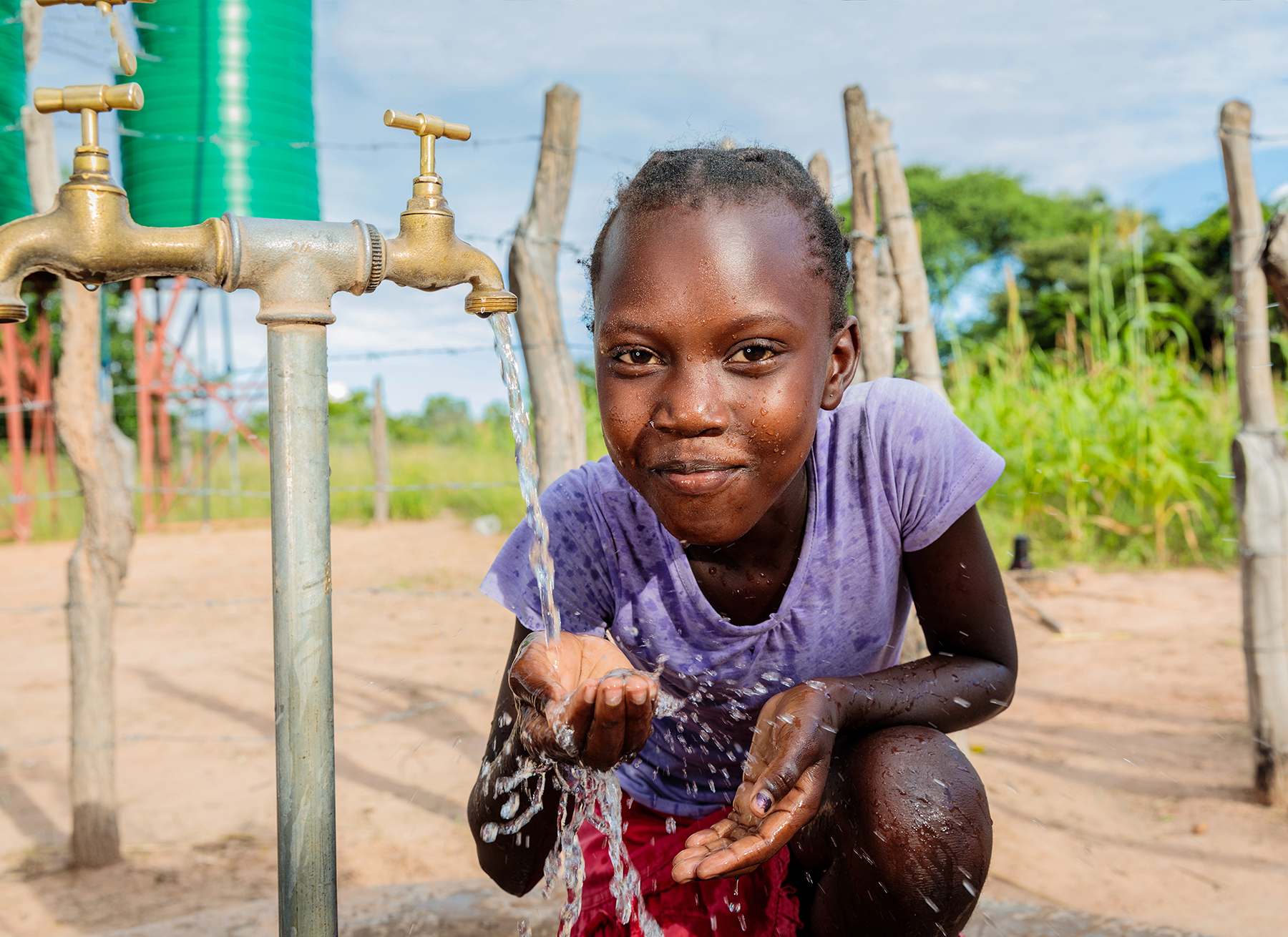 Thandolwayo collecting water in Zimbabwe