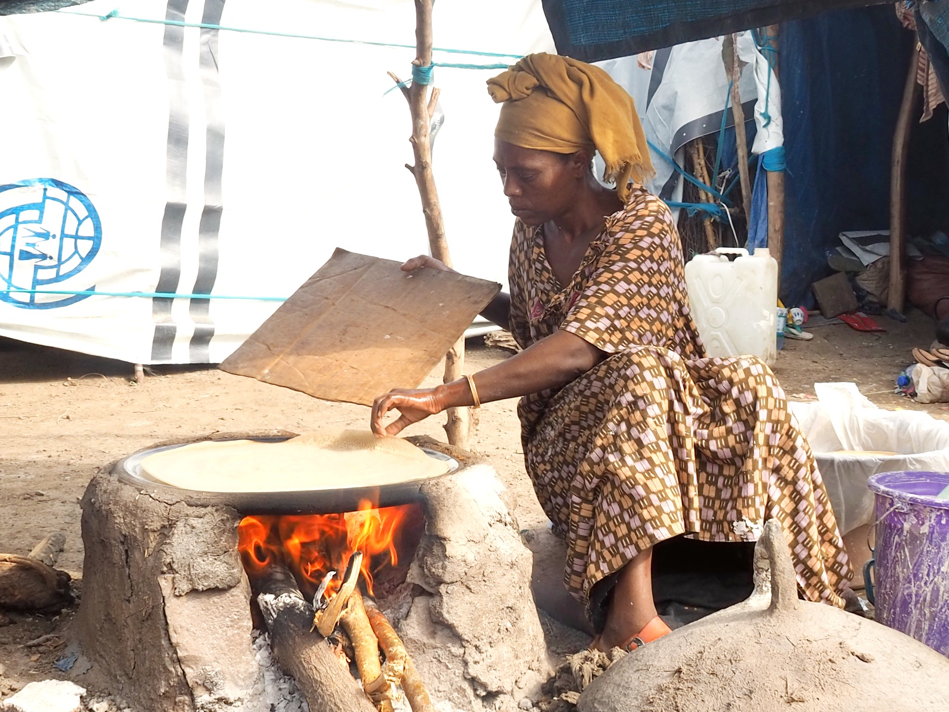 Woman Preparing Food In IDP Camp In Northern Ethiopia. Photo Caritas Australia