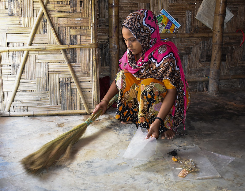 Woman sweeping in Cox's Bazar.