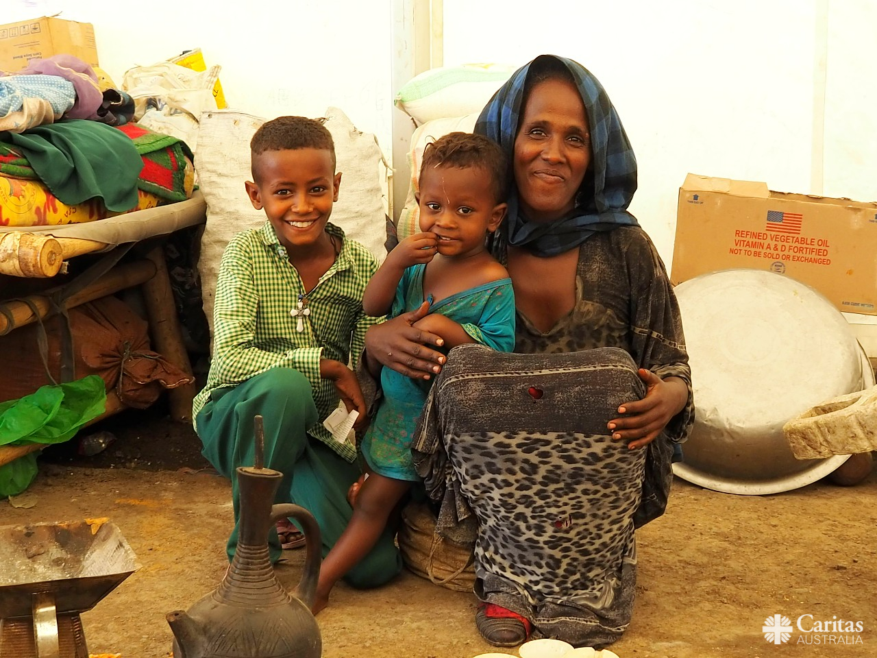 Woman With Her Family In IDP Camp In Northern Ethiopia. Photo Caritas Australia